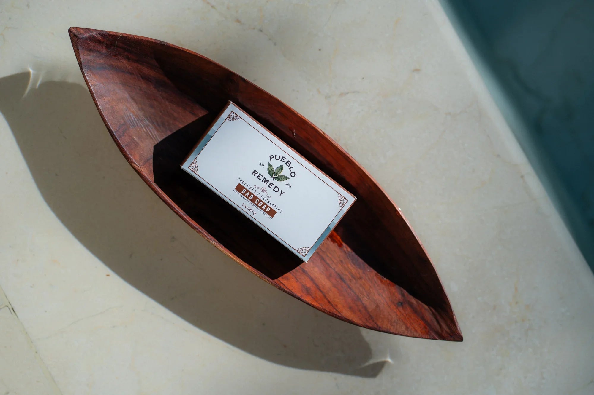Pueblo Remedy Cucumber & Eucalyptus Bar Soap in wooden dish